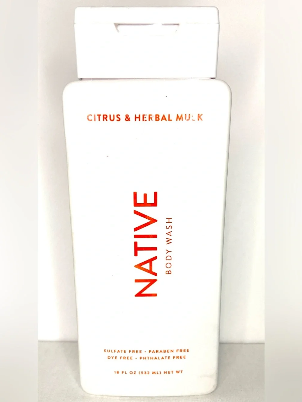 Native Citrus & Herbal Musk Body Wash — White with Orange Text